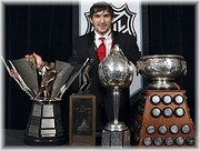 Washington Capitals hockey player Alex Ovechkin, of Russia , poses with, from left, the Rocket Richard, Lester B. Pearson, Hart and Art Ross trophies after winning them at the NHL awards ceremony in Toronto on Thursday June 12, 2008. © www.examiner.com